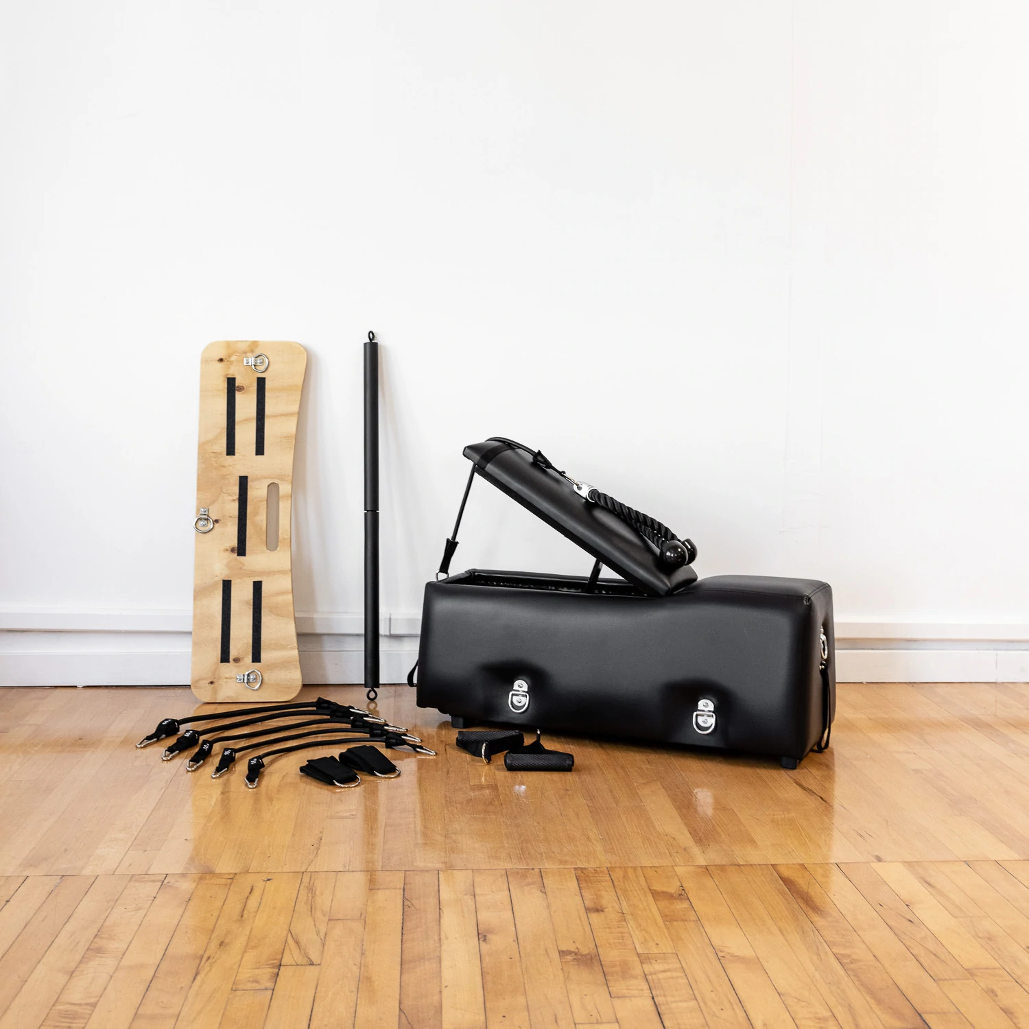 A workout bench with additional accessories in an living room setting