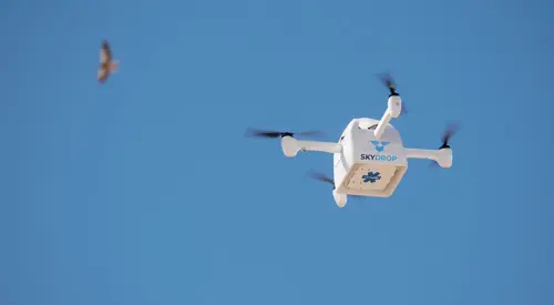 Photo of a SkyDrop drone in flight.